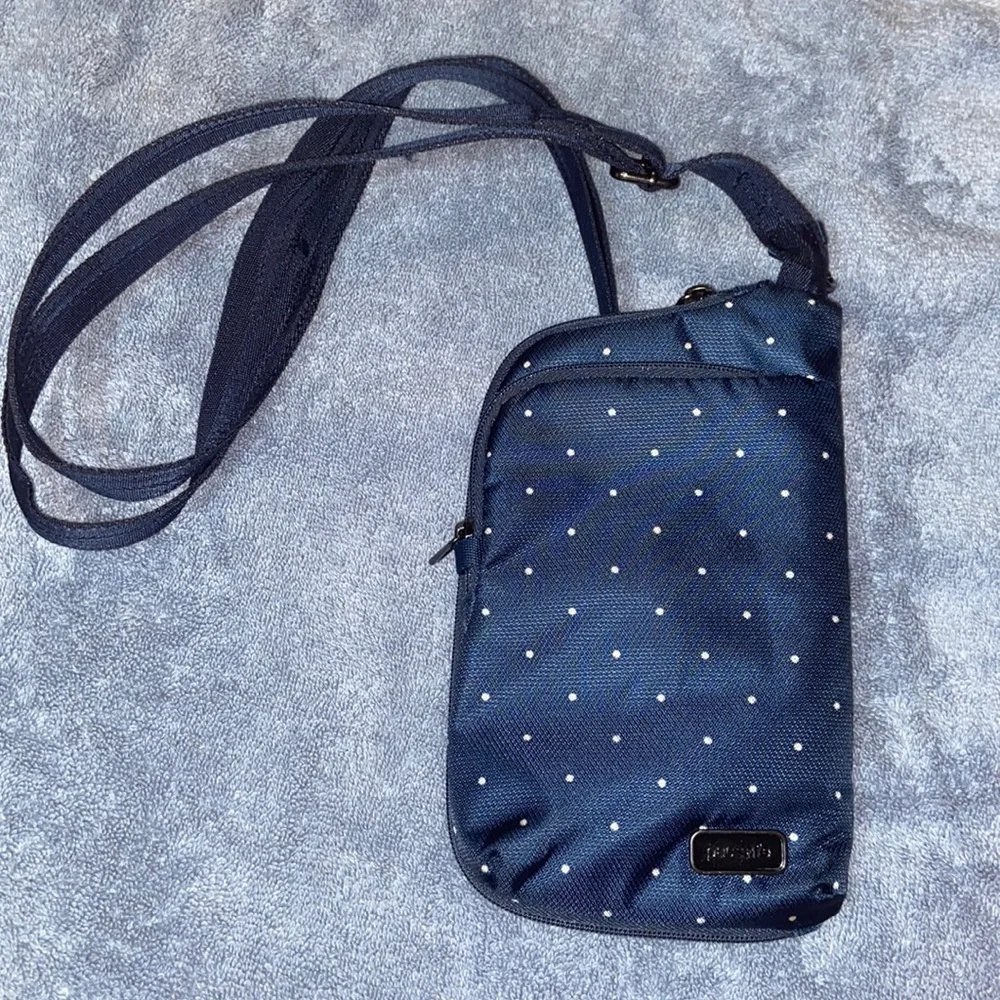 Nwot Pacsafe mini crossbody travel pouch, RFID safe